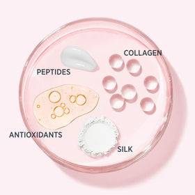 IT Cosmetics jar beside fingertip for scale showing compact 0.23 oz size for travel