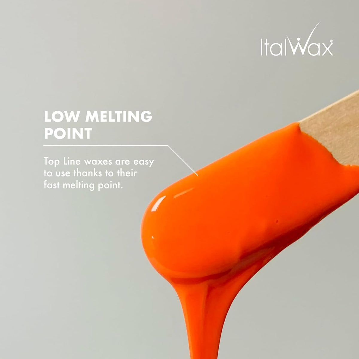 Italwax Coral melted wax on spatula showing smooth spreadability benefit