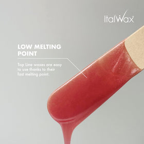 Italwax melted beads in warmer showing glossy consistency and even spreading benefit