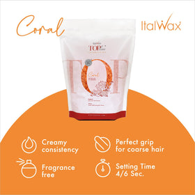 Italwax melted Coral wax on spatula ready to apply, ensuring controlled application