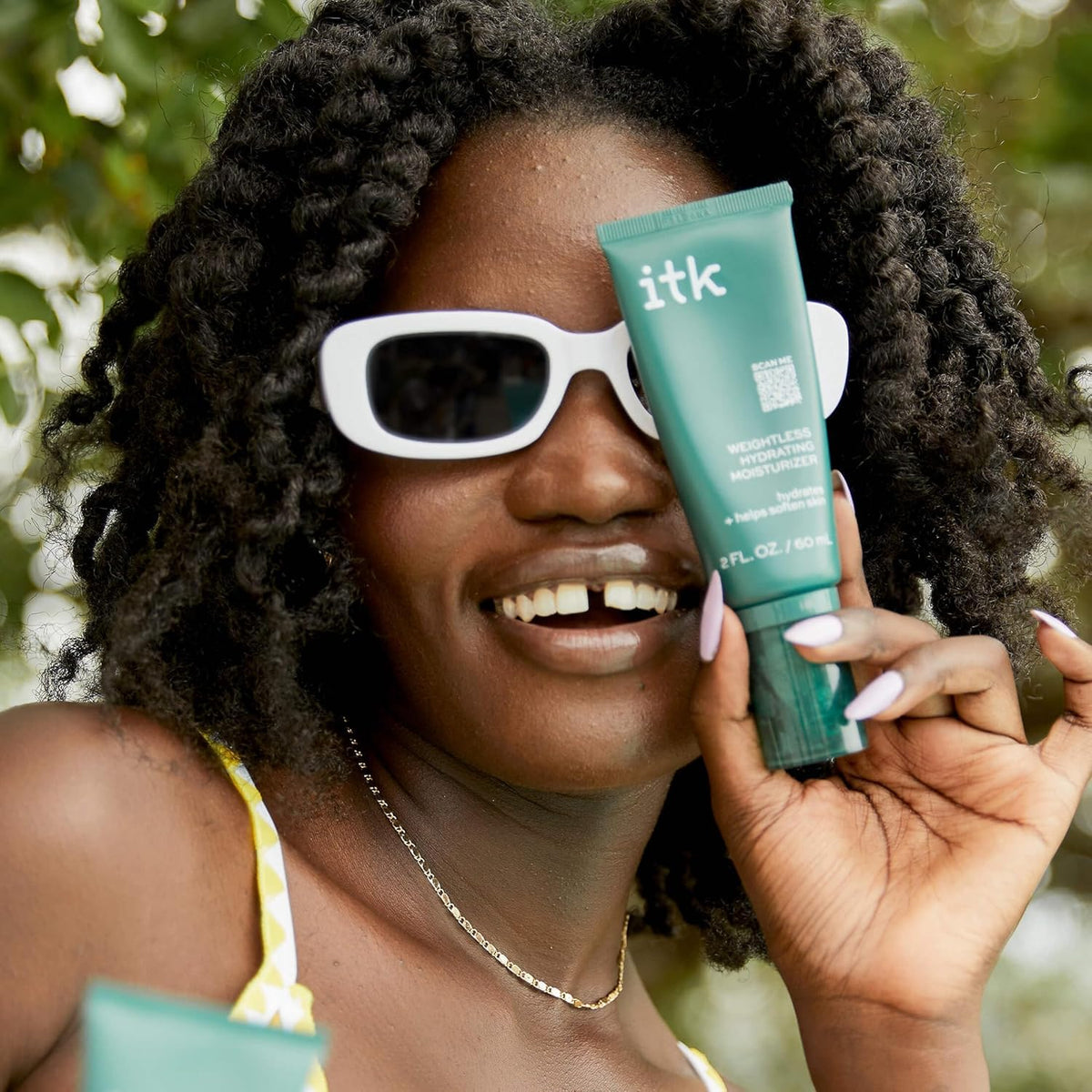 ITK moisturizer on bathroom shelf in morning routine setting, promotes everyday layering