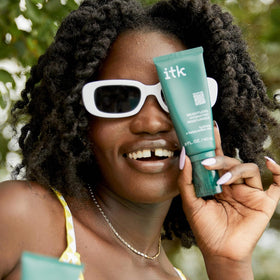 ITK moisturizer on bathroom shelf in morning routine setting, promotes everyday layering