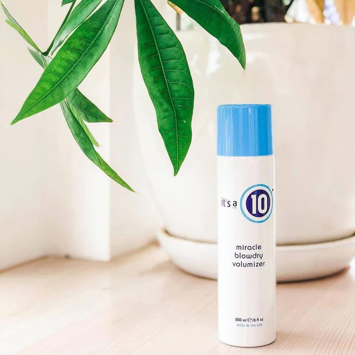 It's A 10 in use while blow-drying to create root lift and fuller hair