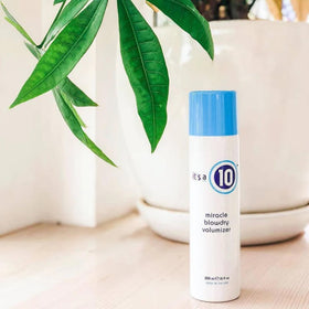 It's A 10 in use while blow-drying to create root lift and fuller hair