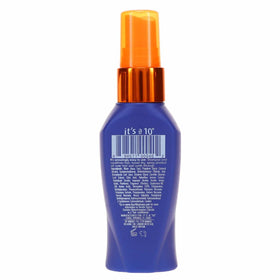 It's A 10 leave-in being sprayed onto damp hair demonstrating easy detangling