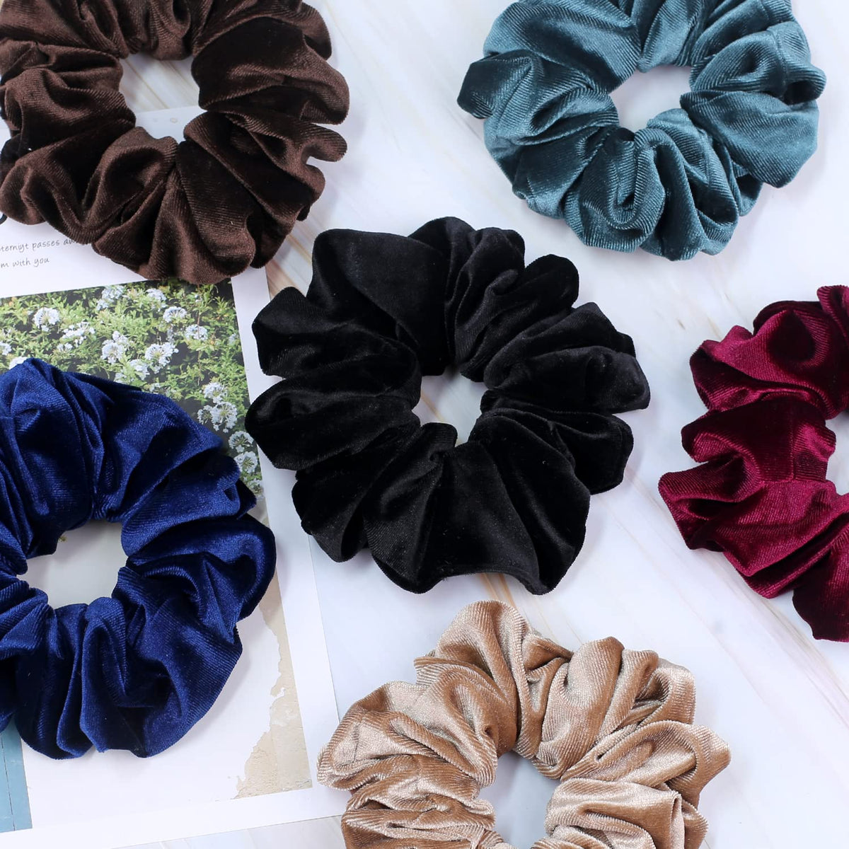 IVARYSS scrunchy held in hand showing 6 inch scale and stretch