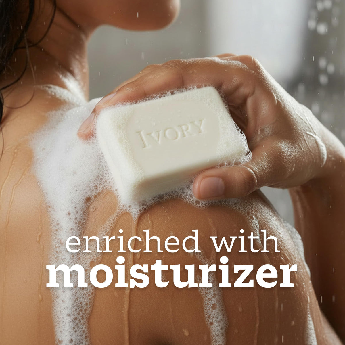 person holding ivory bar soap lathered for effective gentle cleaning, Ivory brand