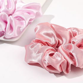 Ivyu satin close-up texture showing smooth fabric that reduces hair friction