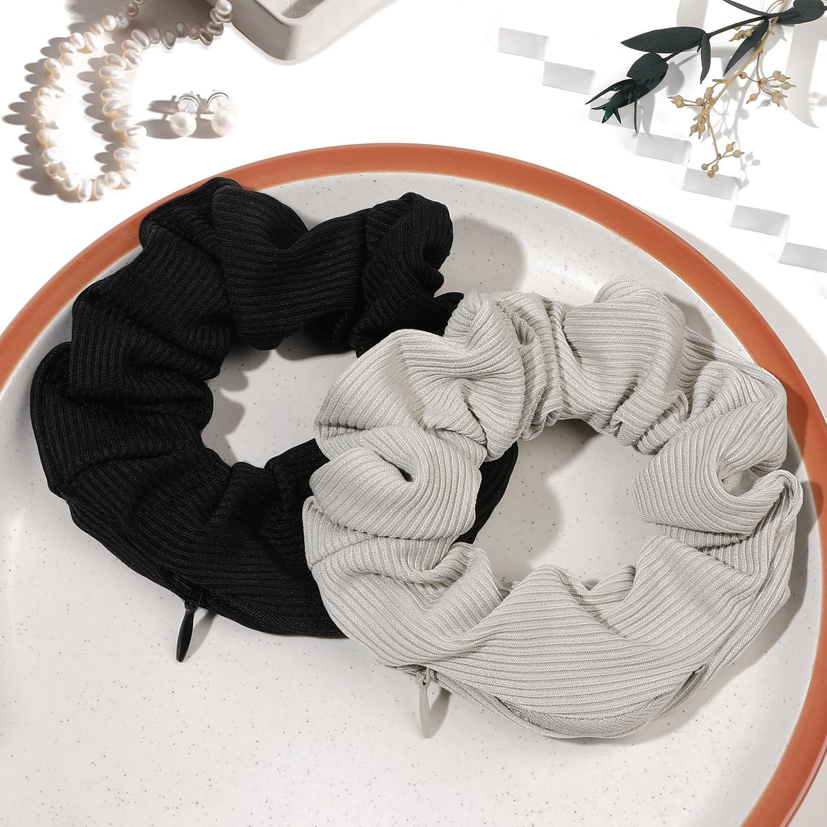 Ivyu scrunchie held in hand for scale, shows compact convenience