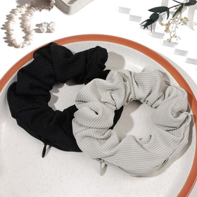 Ivyu scrunchie held in hand for scale, shows compact convenience