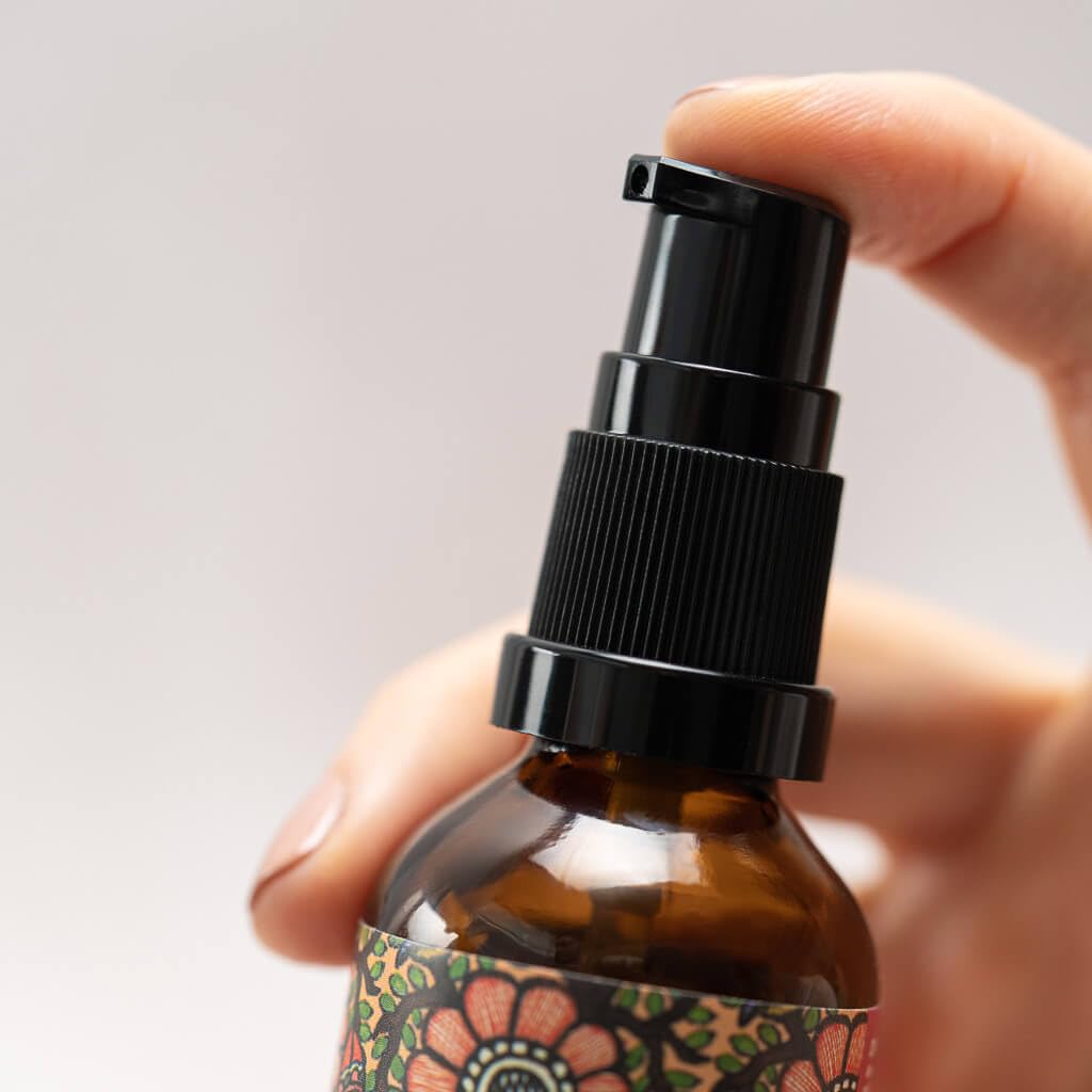 Turmeric and vetiver botanicals beside bottle with The Ayurveda Experience emphasizing nutrient boost