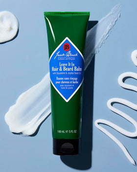 Jack Black applying balm to beard demonstrating tame frizz and softening benefit