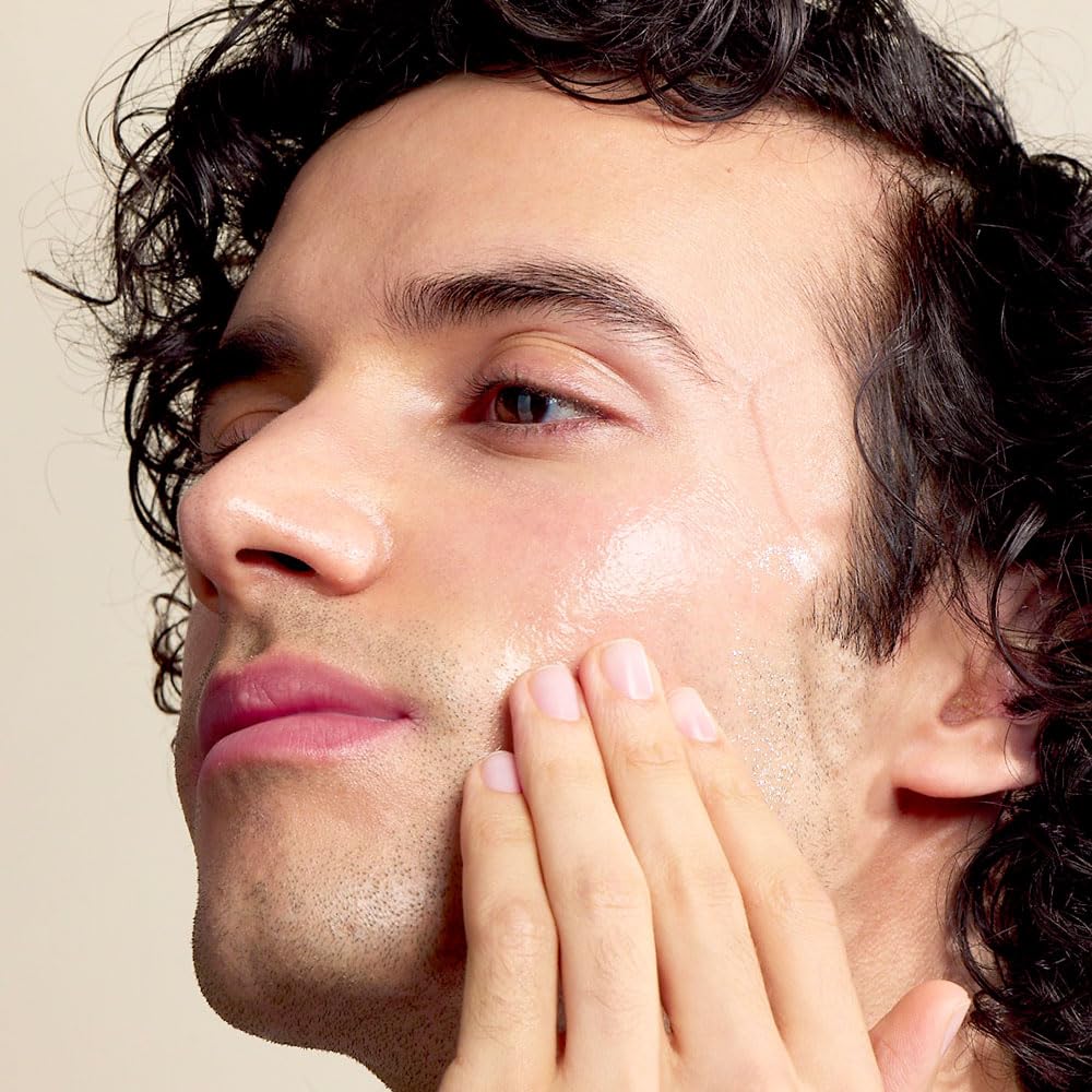 Jack Black applying oil to hands for hydration and fast-absorbing nourishment