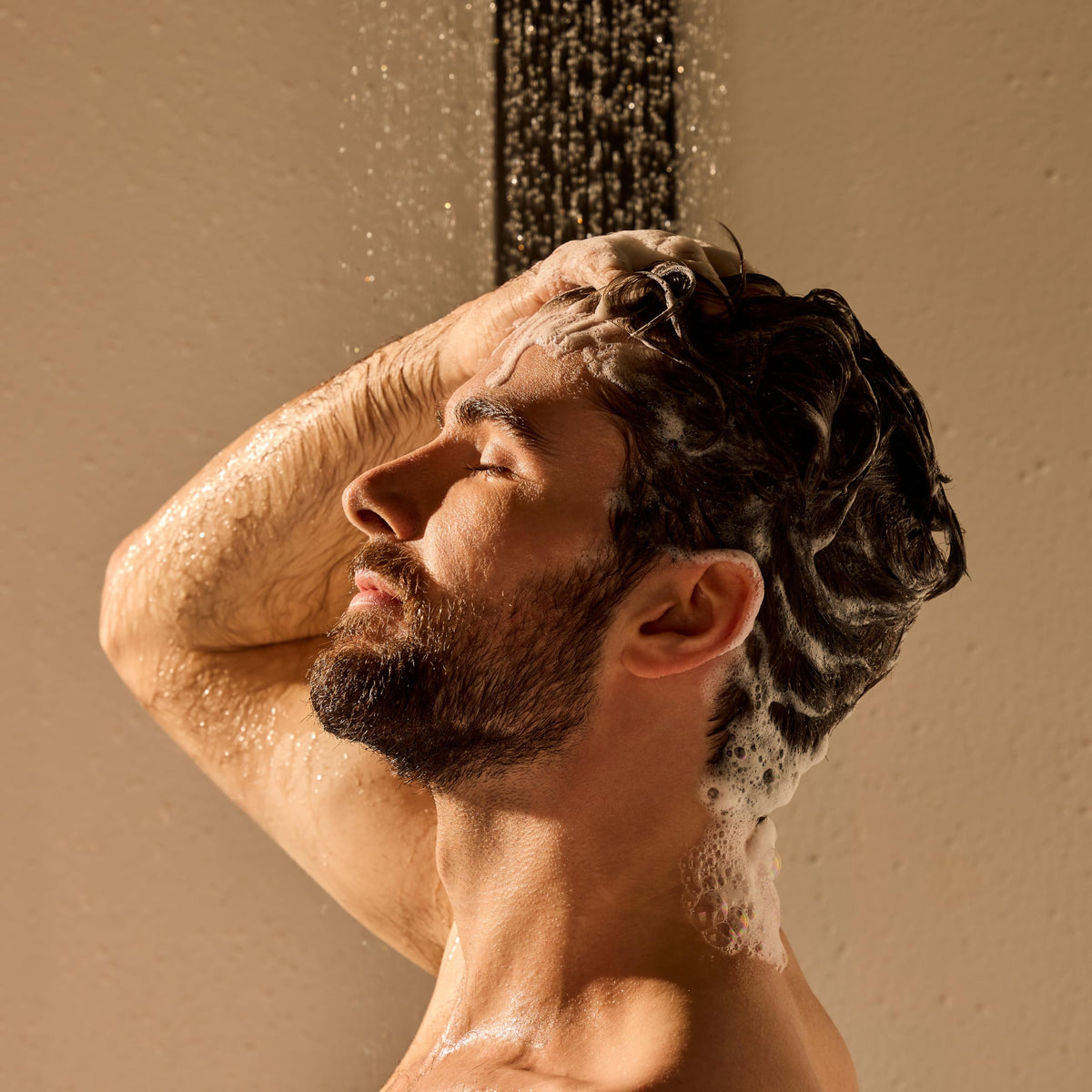 Jack Black shampoo in use on wet hair showing removal of oil and buildup