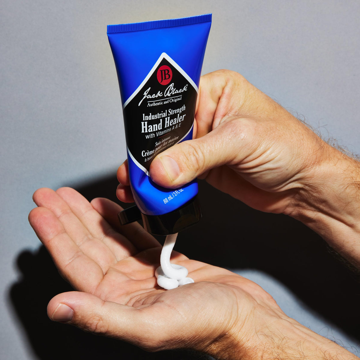 Jack Black cream being applied to hands for fast hydration