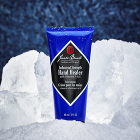 Jack Black tube beside a golf glove illustrating portable 3 fl oz size