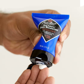 Jack Black tube beside razor showing travel-friendly daily protection