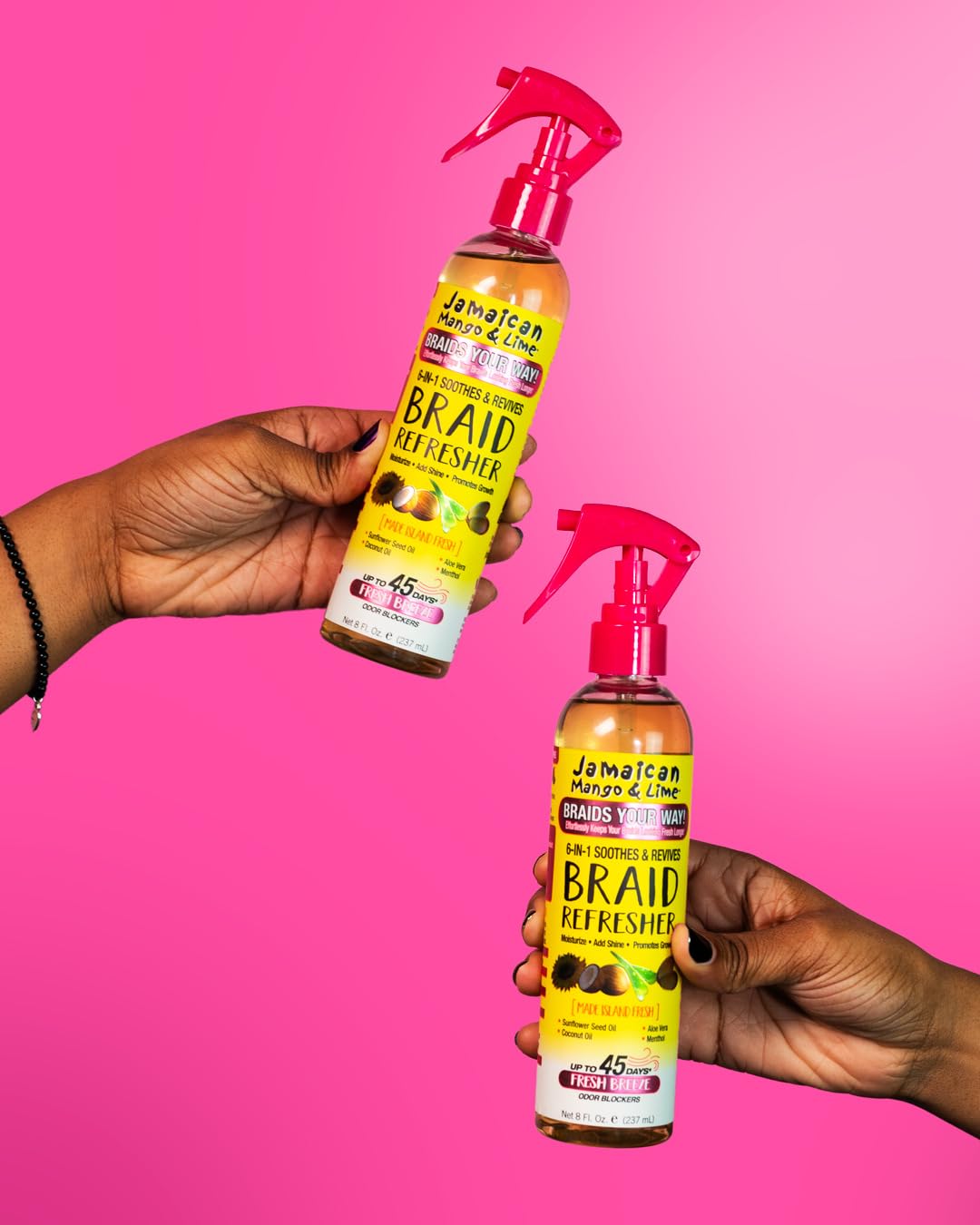 Jamaican Mango & Lime being sprayed on braids to relieve itch and refresh