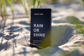 JAXON LANE next to coin for size scale demonstrating 2.03 oz portability