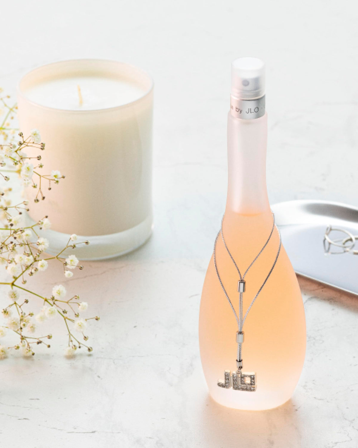 Jennifer Lopez Glow bottle in brunch setting suggesting light daytime wear