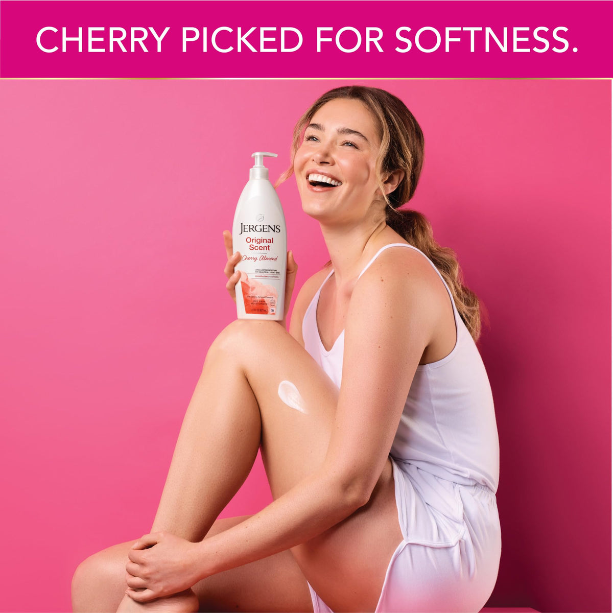 Hands applying Jergens lotion to show moisturized, smoother skin result