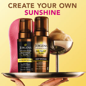 Jergens 6 oz mousse beside hand to show size and travel convenience