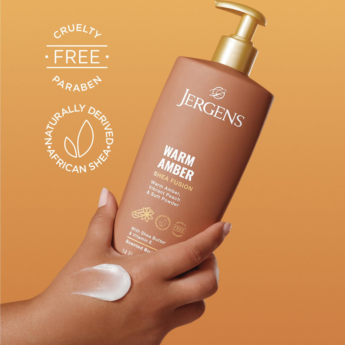 Jergens 14 fl oz bottle next to hand to show true product scale