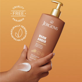 Jergens 14 fl oz bottle next to hand to show true product scale