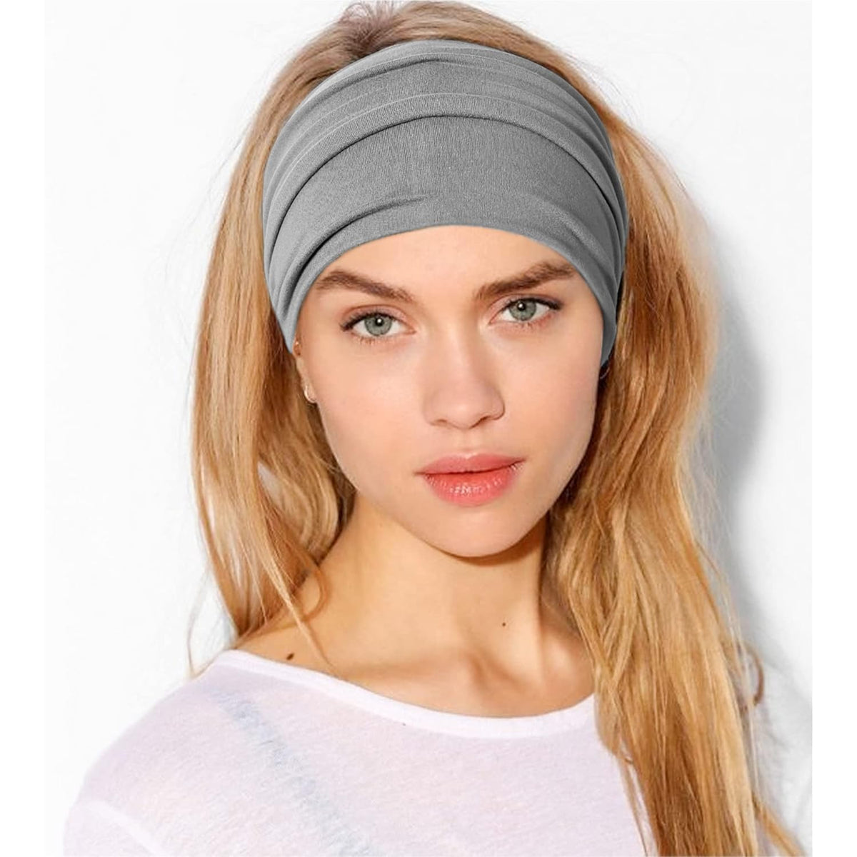 Jesries headband beside a ruler demonstrating stretch and size, proving fit