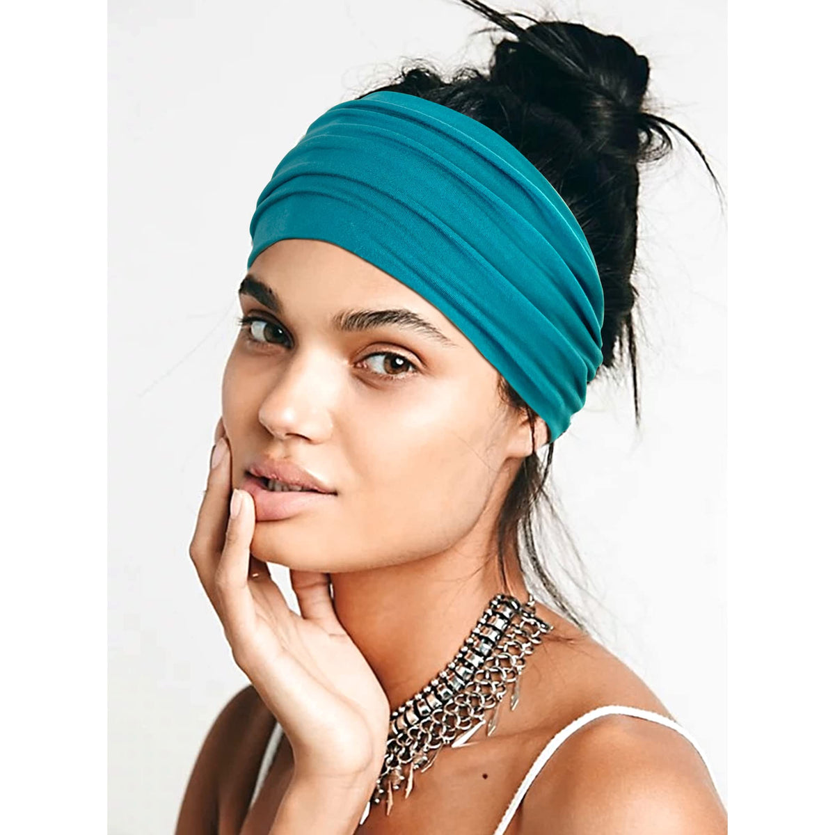 Jesries headband next to hand showing 5.1-inch width scale
