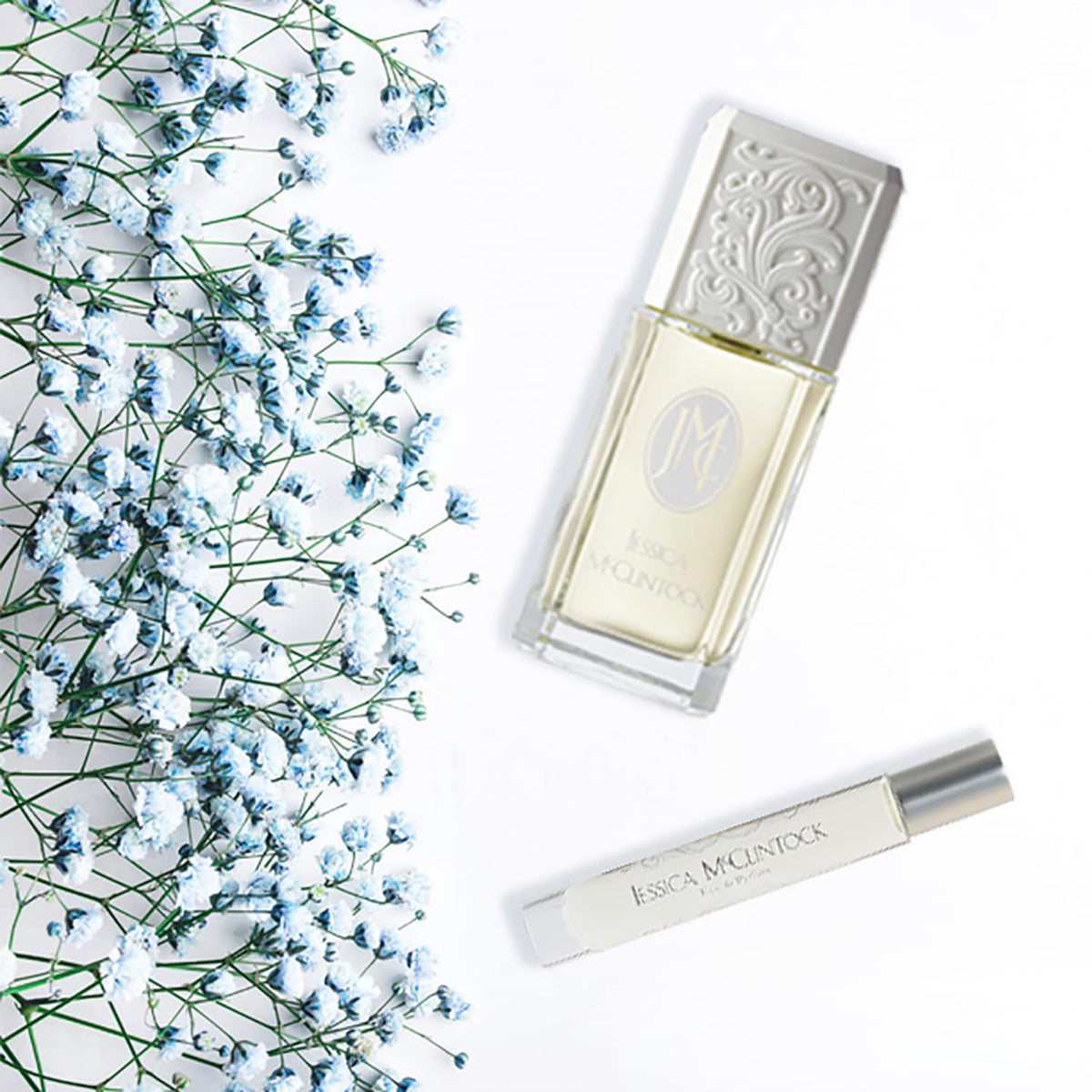 Jessica McClintock rollerball held in hand showing size and easy portability benefit