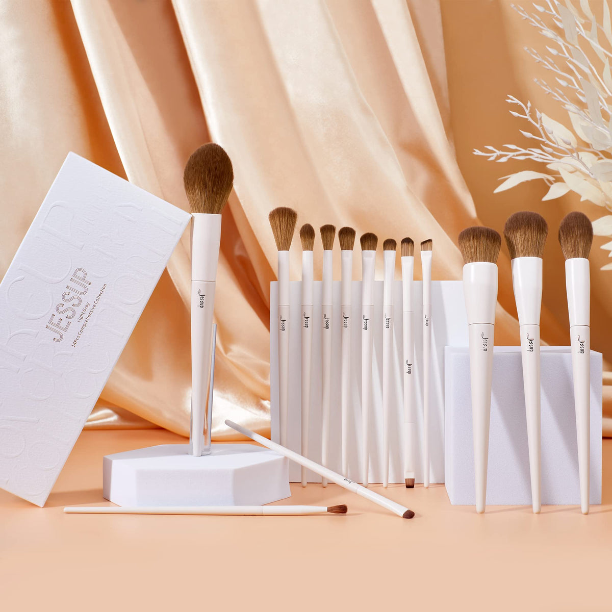 Jessup brush set size comparison held in hand to illustrate scale and portability