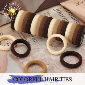 JIRIS hair tie next to a coin for scale showing compact size and portability