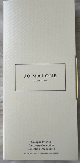 Jo Malone minis in hand to show travel size and portability for sampling on the go