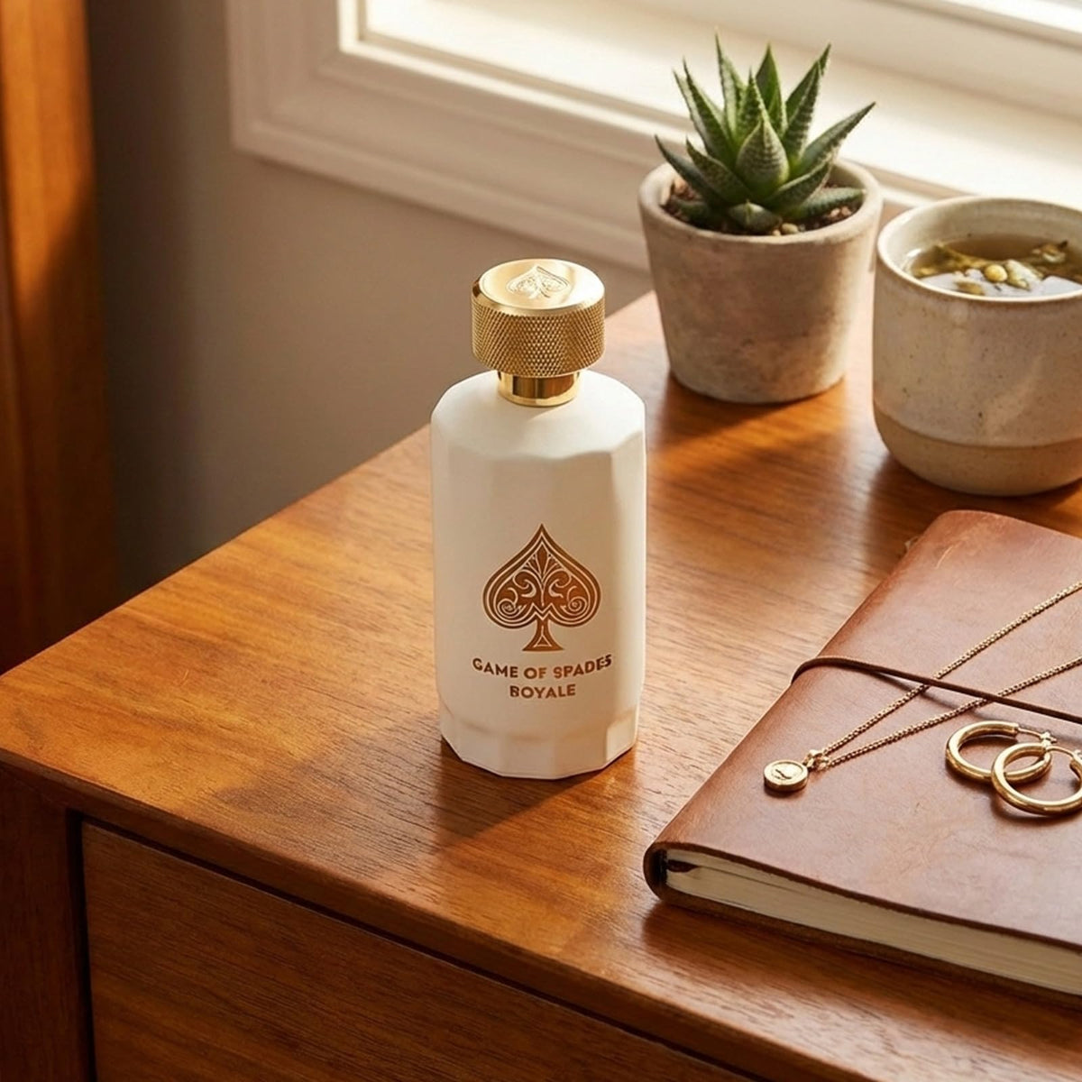 Jo Milano Game of Spades Royale liquid color and texture visible in bottle conveying fragrance depth benefit