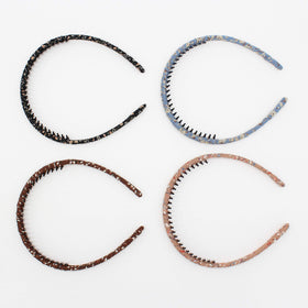JOBAND close-up of resin teeth highlighting non-slip grip and scalp comfort