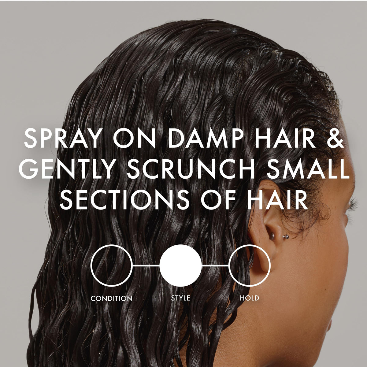 John Frieda close detail of defined curl spiral, enhances shape and shine