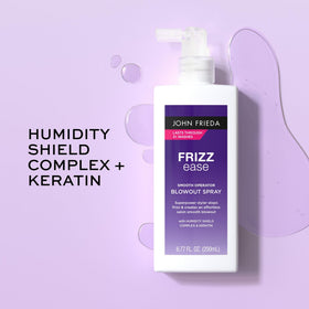 John Frieda product on a vanity with brush and towel suggesting styling routine