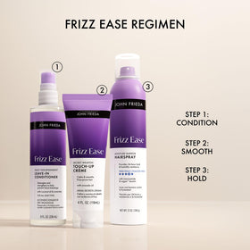 John Frieda lifestyle shot of woman touching up hair outdoors showing instant refresh