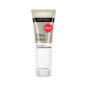 John Frieda bottle front view showing product and volumizing benefit