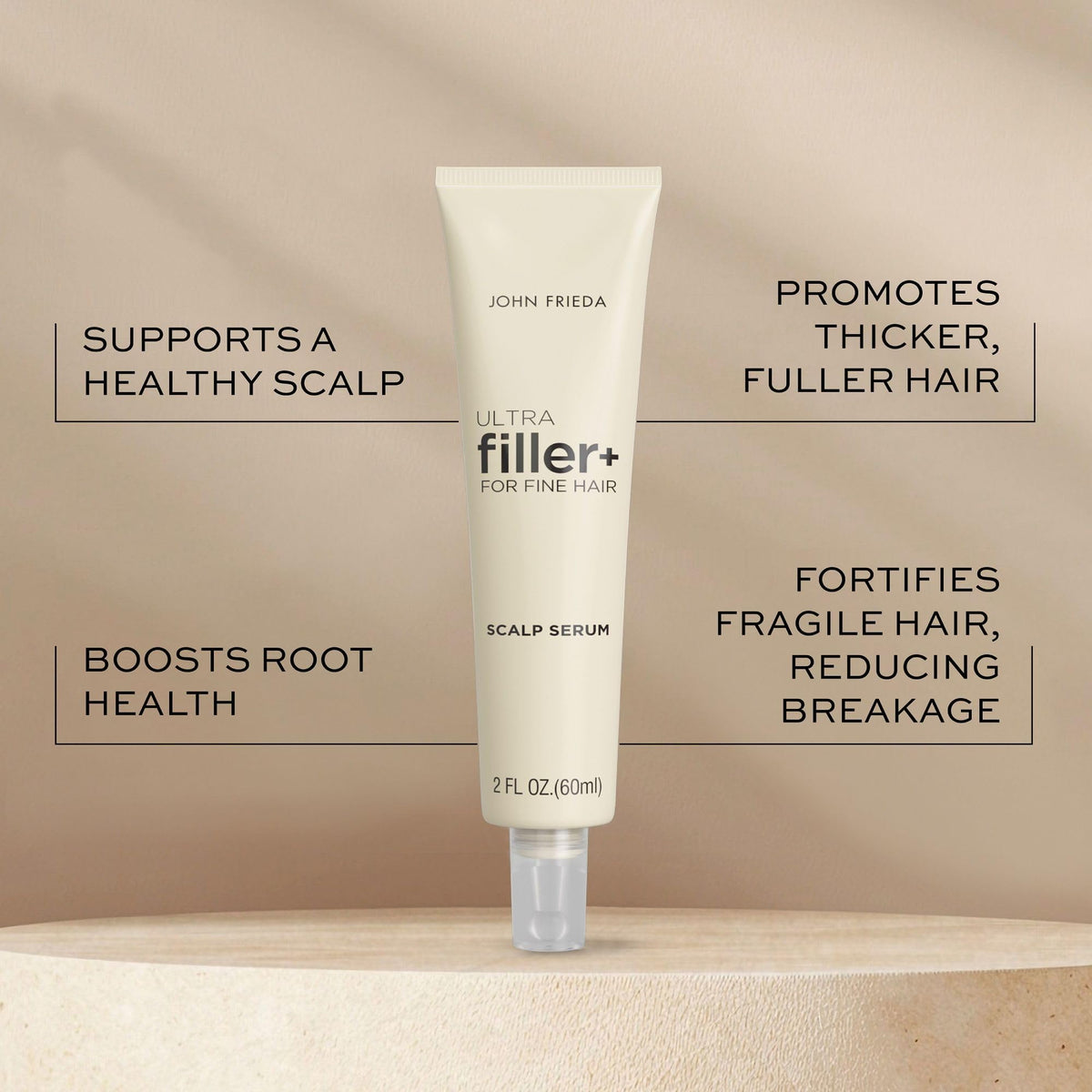 John Frieda dropper dispensing serum onto fingertips for precise application benefit