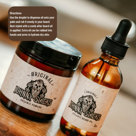 Johnny Slicks bottle next to hand for scale showing compact, travel‑friendly size benefit