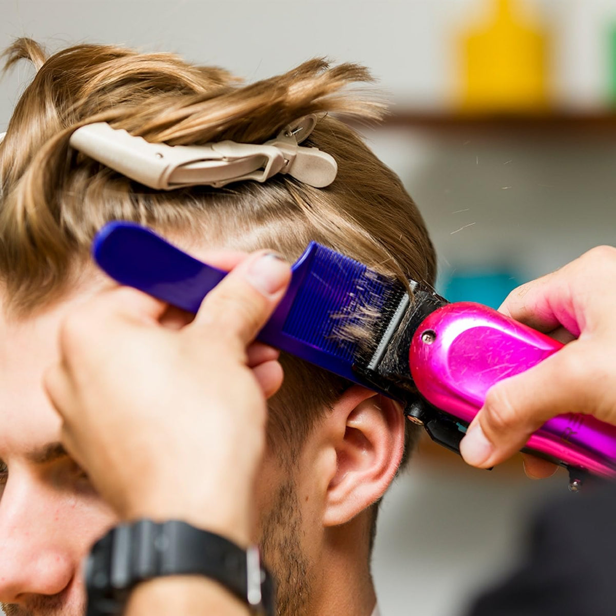 JOHNNY B. combs styled with barber tools in a kit to demonstrate professional readiness