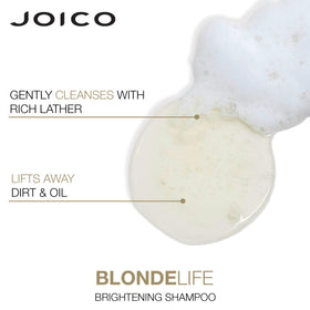 Joico conditioner being combed through damp hair for easy manageability