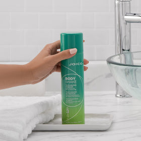 Joico Body Shake texture swatch illustrating lightweight powder-liquid finish for touchable fullness