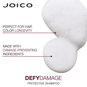 Joico bottles held in hand to show 10.1oz and 8.5oz sizes for scale
