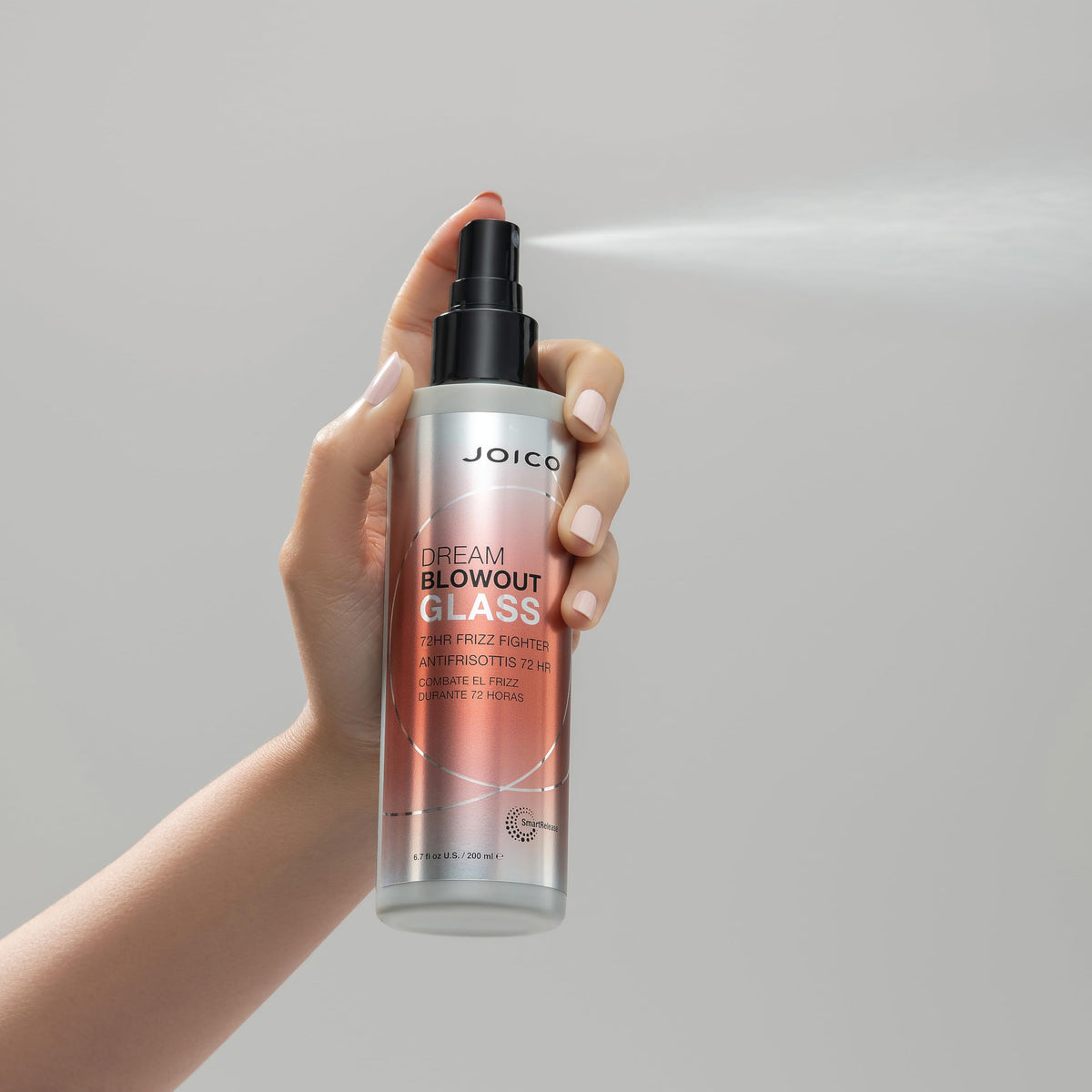 Joico applied to damp hair before blow-dry illustrating frizz control and protection