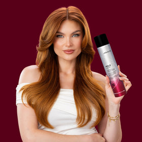 Hand holding Joico can to show 9 oz size and portability benefit
