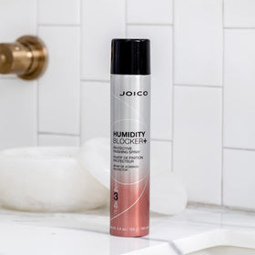 Joico product used on fresh blowout illustrating frizz reduction and hold benefit