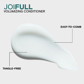 Joico conditioner in hands being applied to hair, demonstrates easy detangling benefit